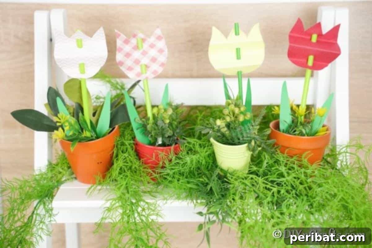 Create Charming Spring Paper Tulips 14 Finished paper tulips arranged in small flower pots on a clean white shelf, ready for display