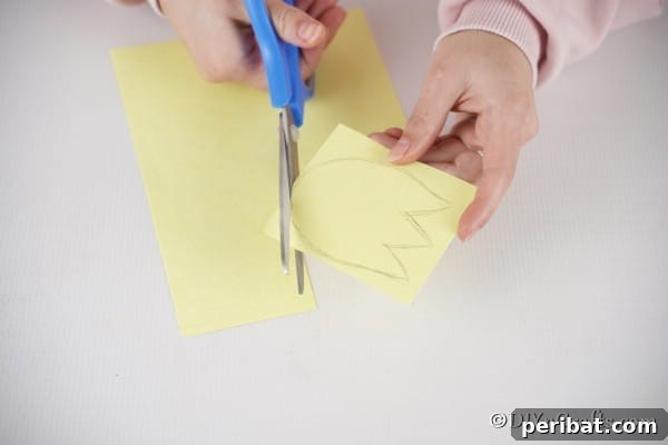 Create Charming Spring Paper Tulips 16 Cutting tulip shape from yellow paper