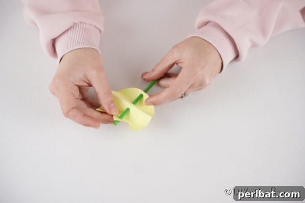 Create Charming Spring Paper Tulips 19 Sliding straw through holes in paper