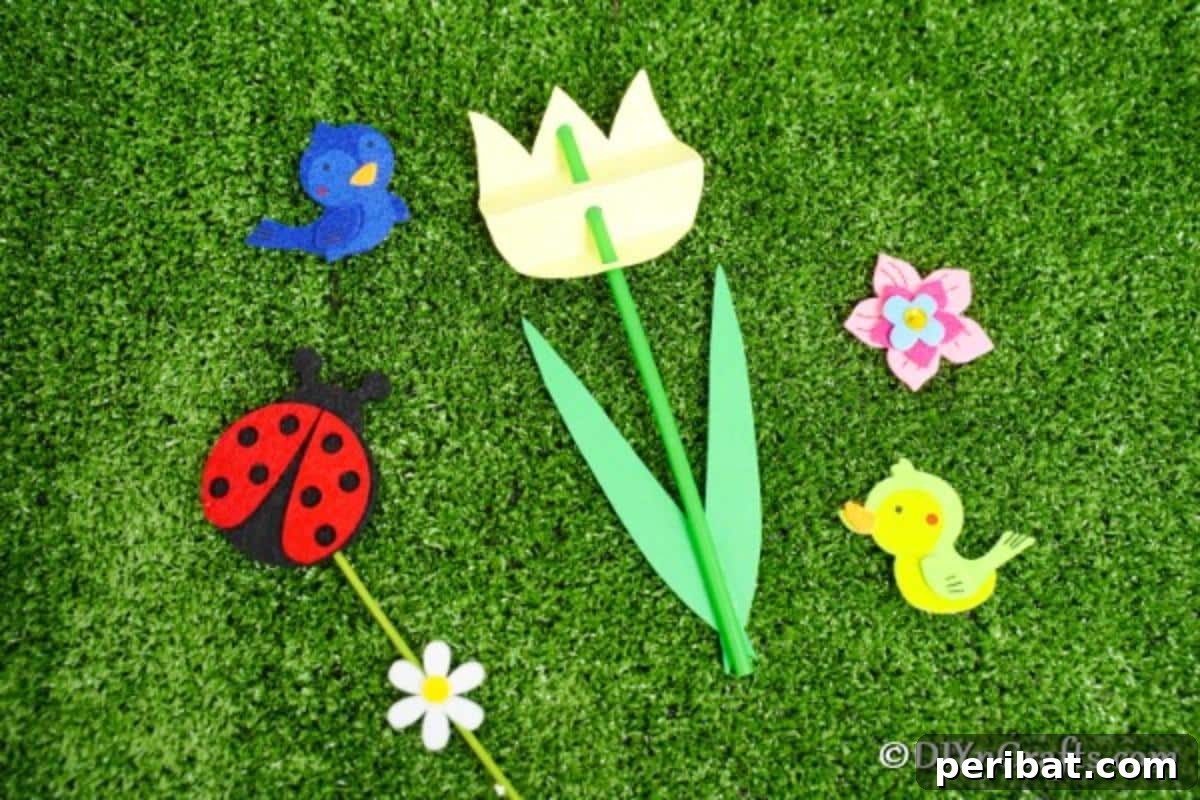 Create Charming Spring Paper Tulips 4 Close-up of a single yellow paper tulip resting on a vibrant green grass surface