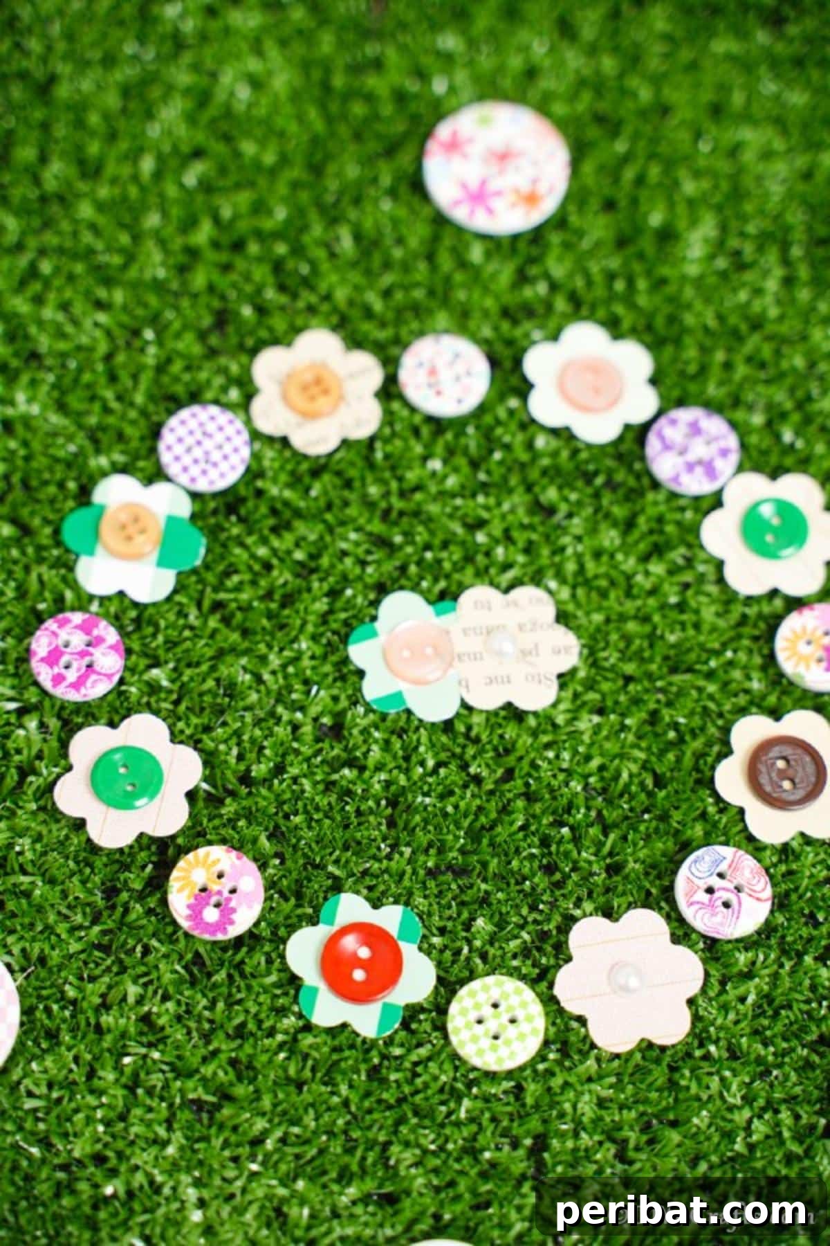 DIY Paper Button Blossoms 4 Assorted paper button flowers gracefully resting on faux grass