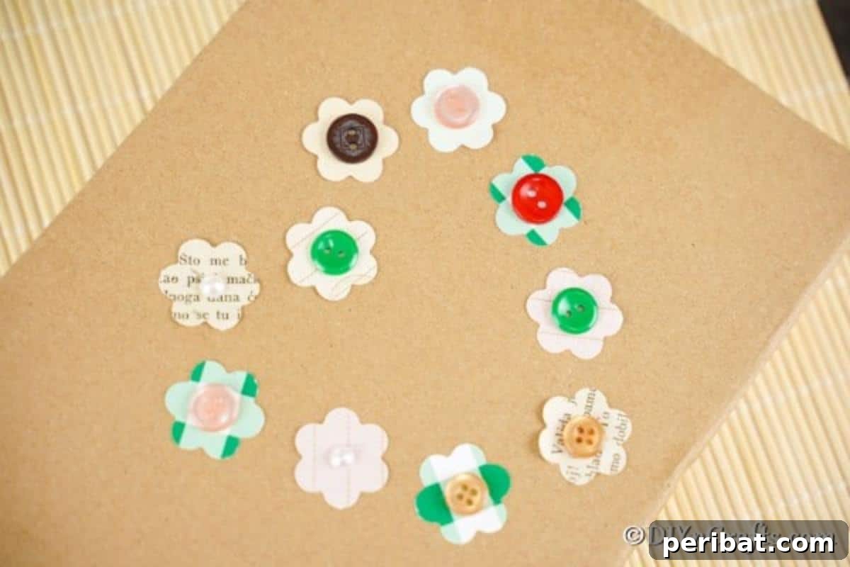 DIY Paper Button Blossoms 5 Paper button flowers artfully arranged on a piece of cardboard