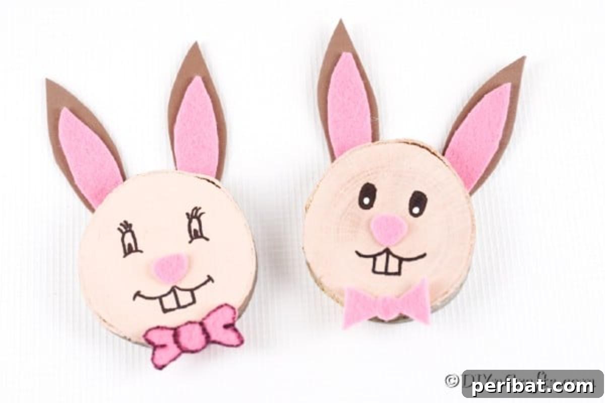 Crafting Whimsical Wood Slice Easter Bunnies 17 Finished Easter bunny wood slice decorations displayed on a white surface.