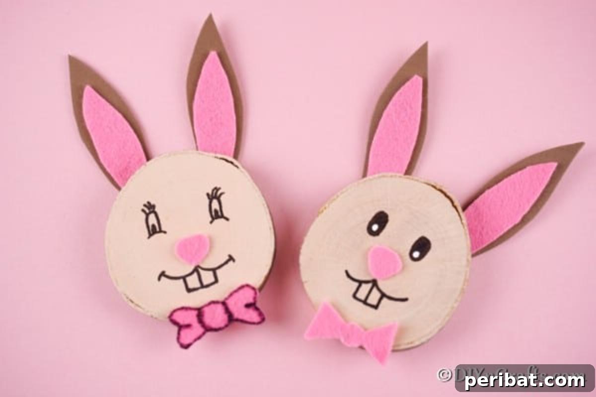 Crafting Whimsical Wood Slice Easter Bunnies 6 Wood slice Easter bunnies on a pink surface, highlighting their cheerful colors and cute design.