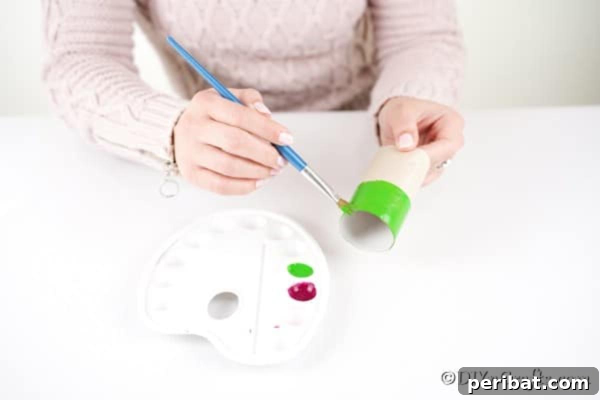 Painting a section of toilet paper roll green