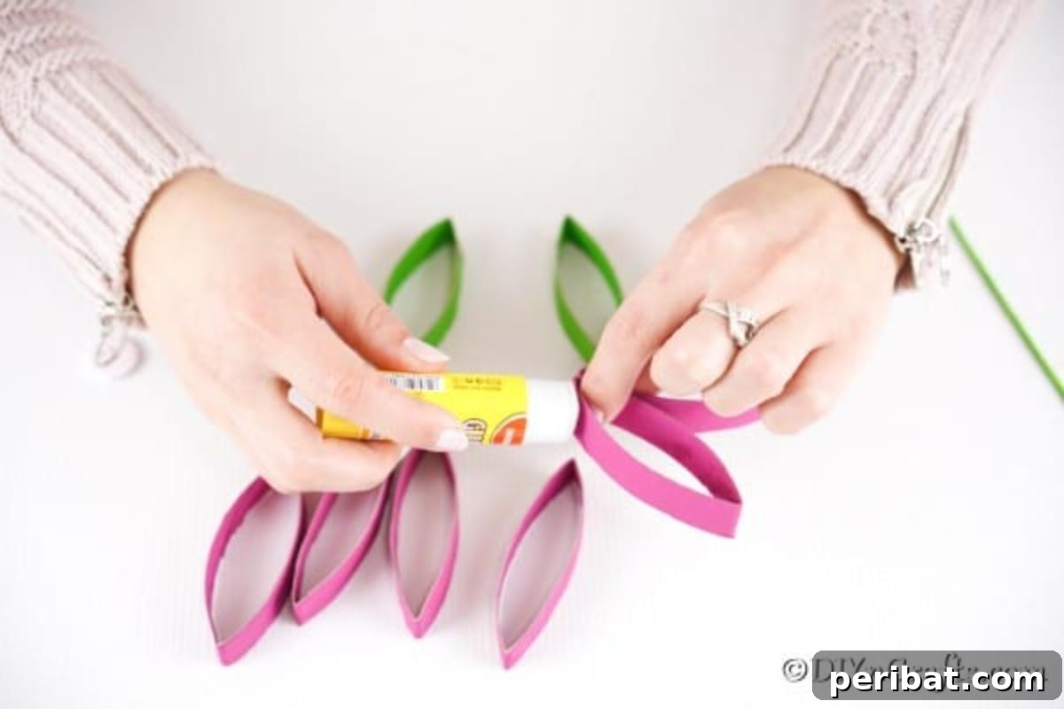 Gluing paper pieces together to form a flower