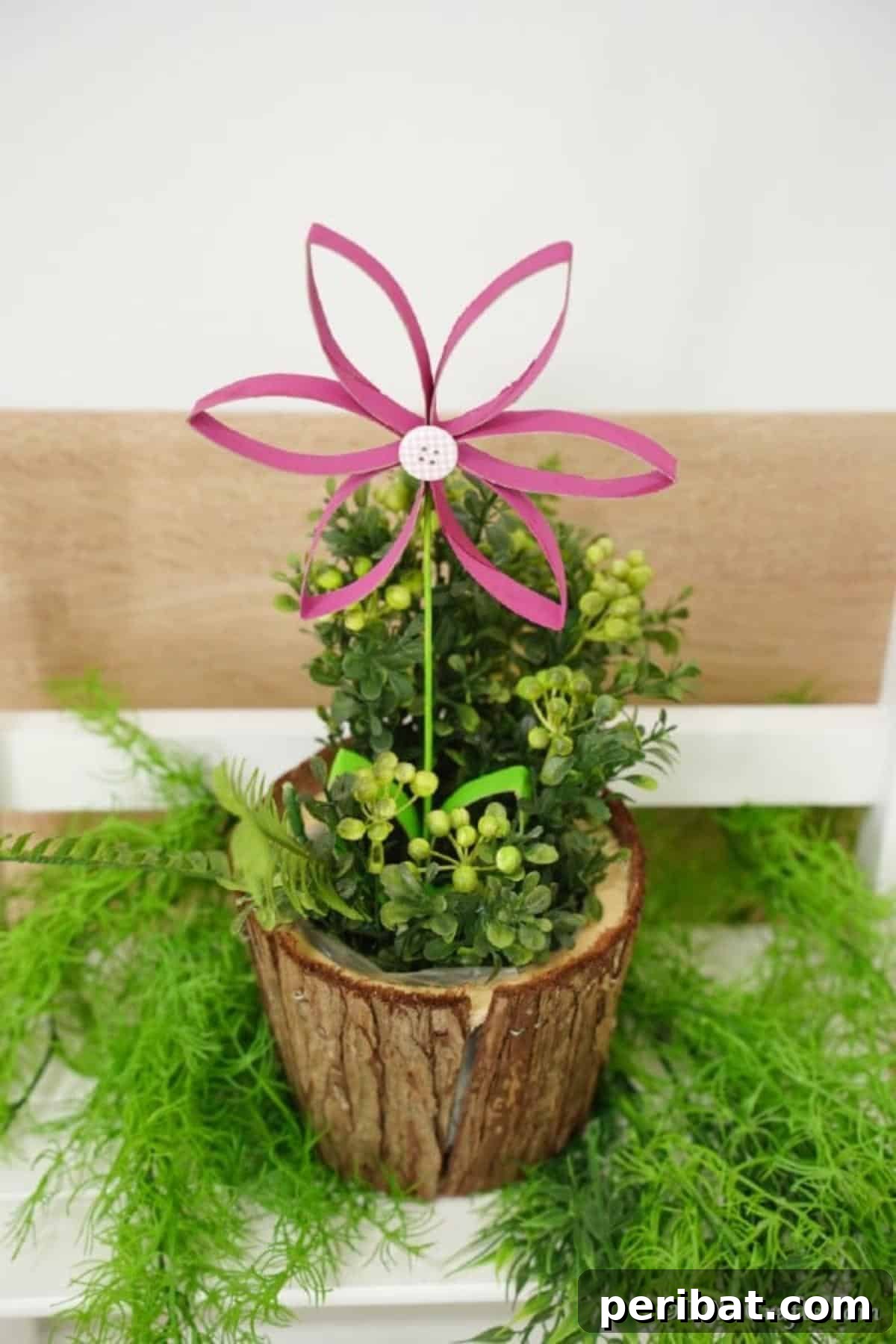 Single toilet paper roll flower displayed in a small planter