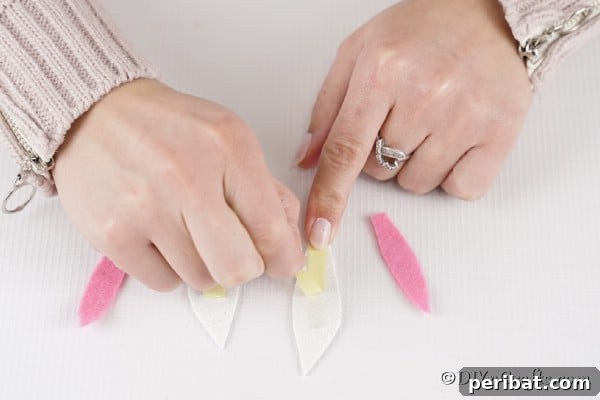 Craft Adorable Easter Bunny Eggs 19 Taping ears together for bunny egg
