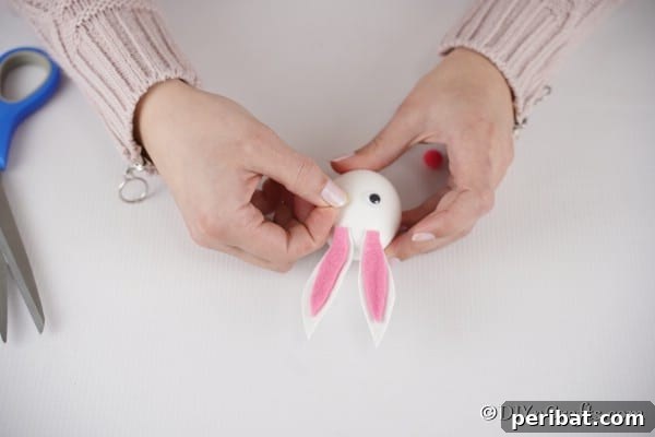 Craft Adorable Easter Bunny Eggs 21 Adding googly eyes to easter egg bunny