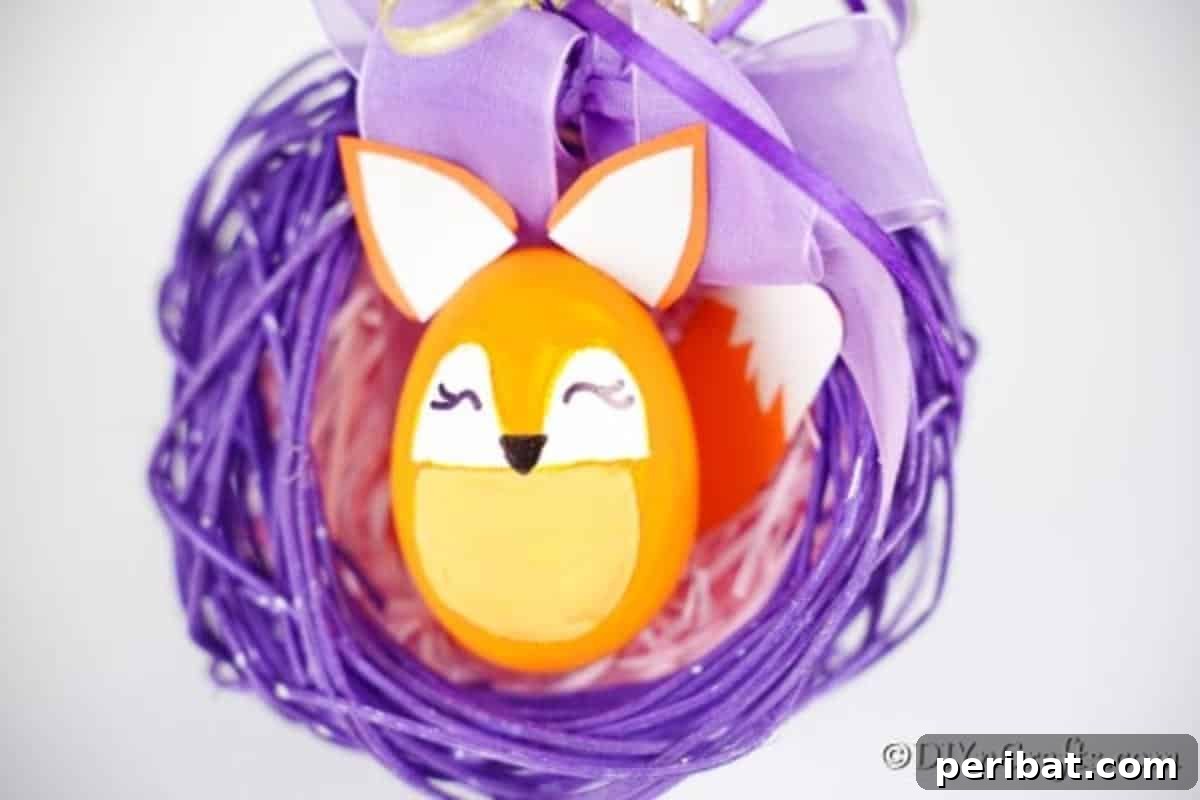 Foxy Fun DIY Easter Egg Project 3 A charming fox Easter egg nestled in a delicate purple wreath, highlighting its intricate details.