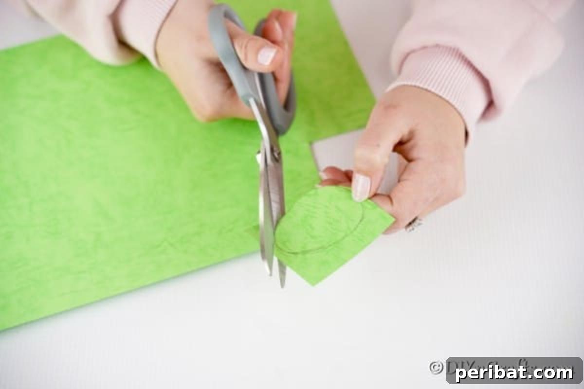 DIY Upcycled Book Page Easter Egg Garland Tutorial 14 Cutting out egg shape from craft paper