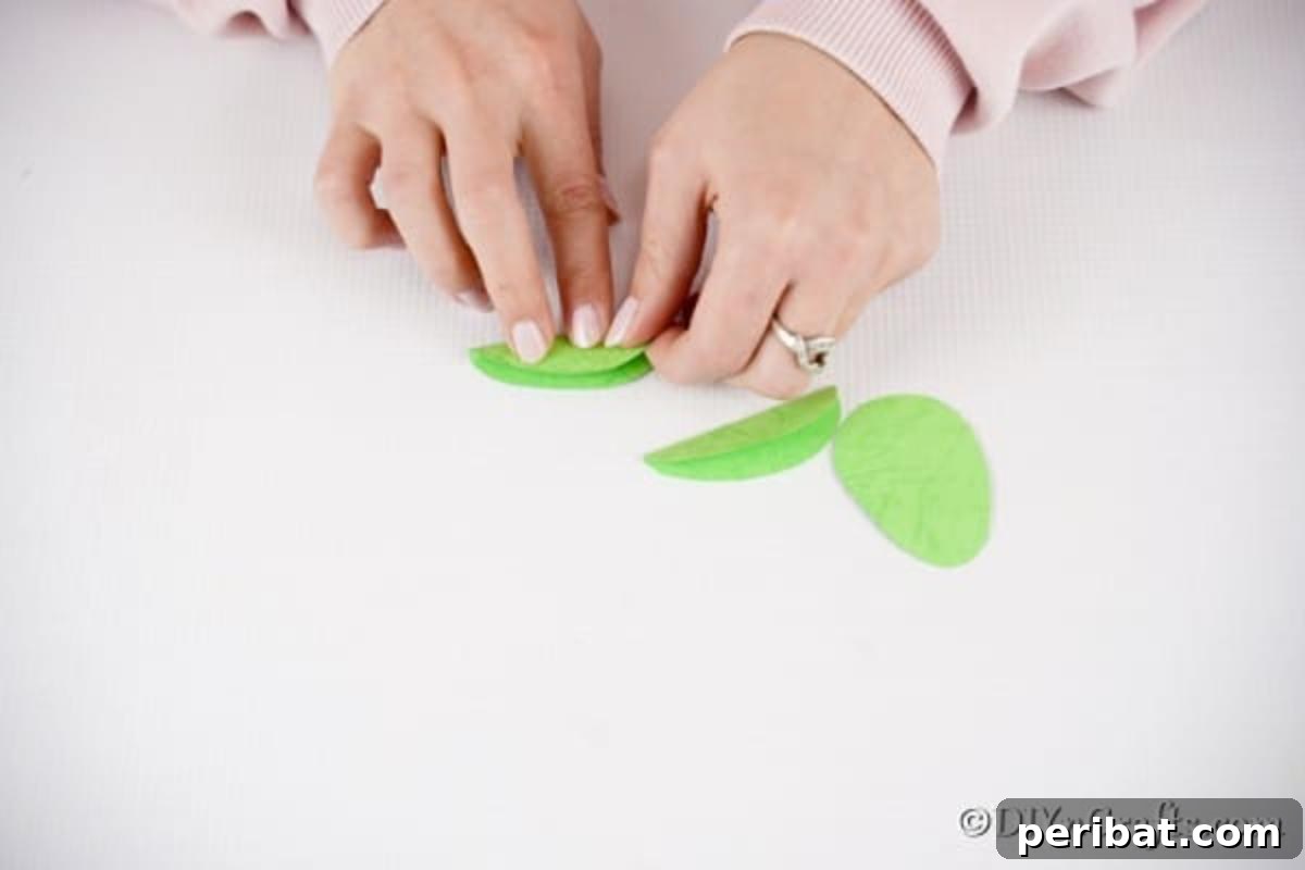 DIY Upcycled Book Page Easter Egg Garland Tutorial 15 Folding egg shape paper