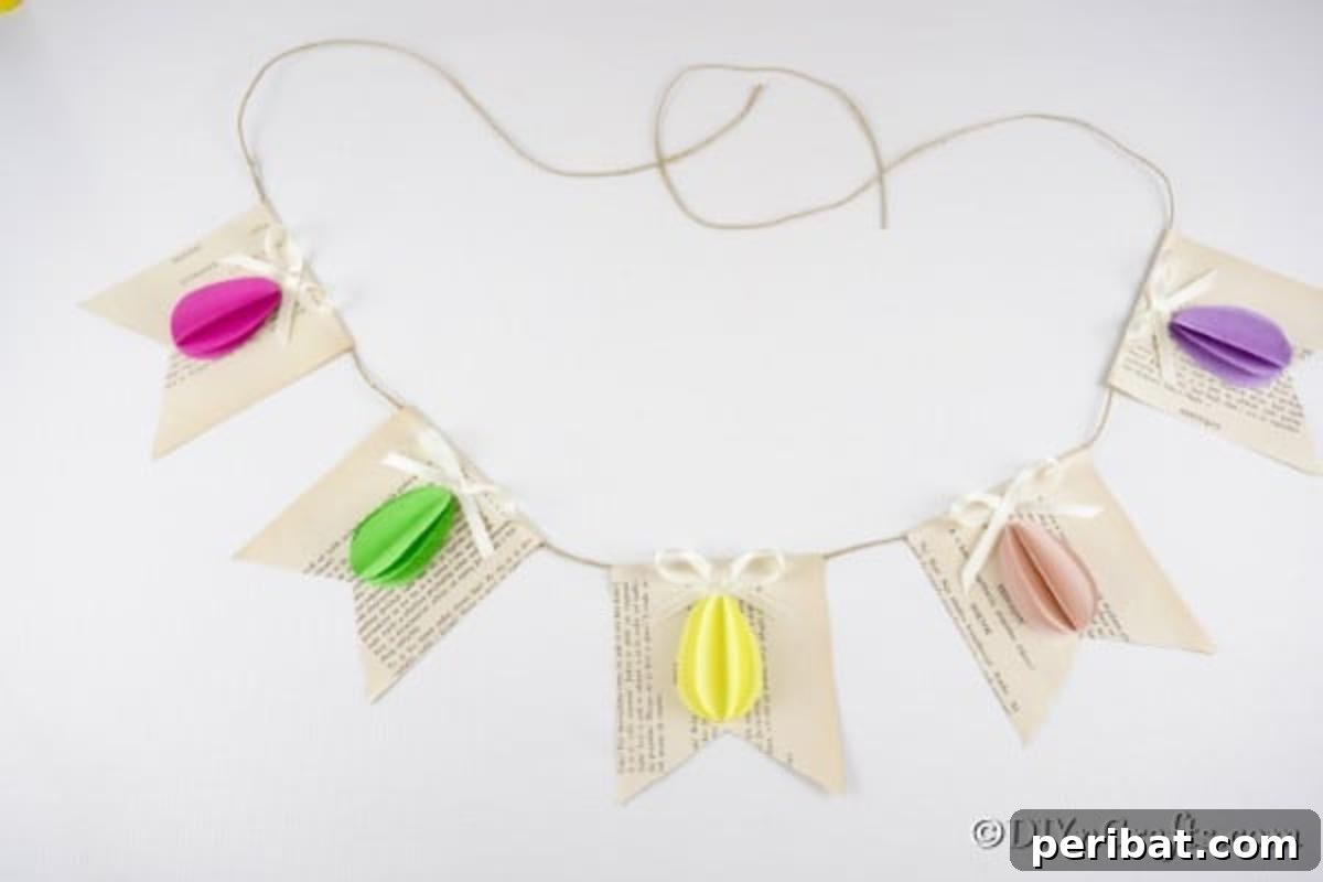 DIY Upcycled Book Page Easter Egg Garland Tutorial 20 3D Egg Easter egg garland on white surface