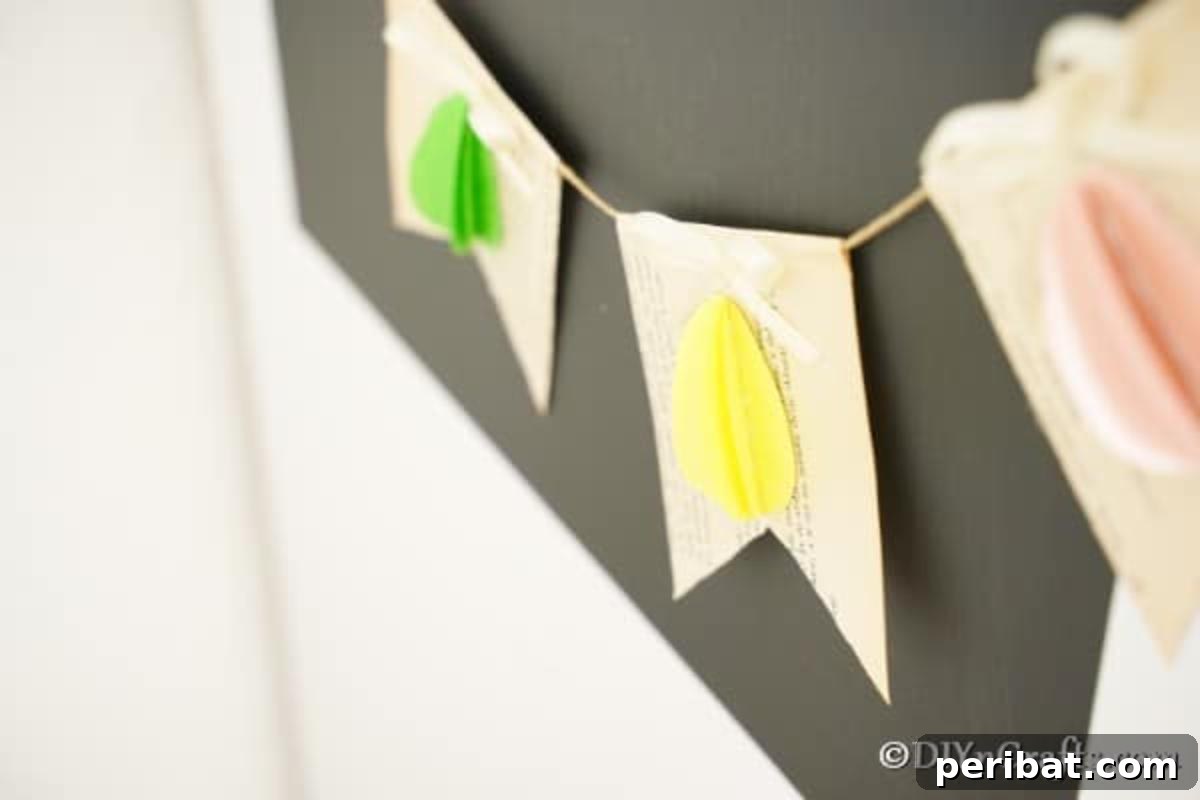 DIY Upcycled Book Page Easter Egg Garland Tutorial 4 Easter egg garland hanging on chalkboard
