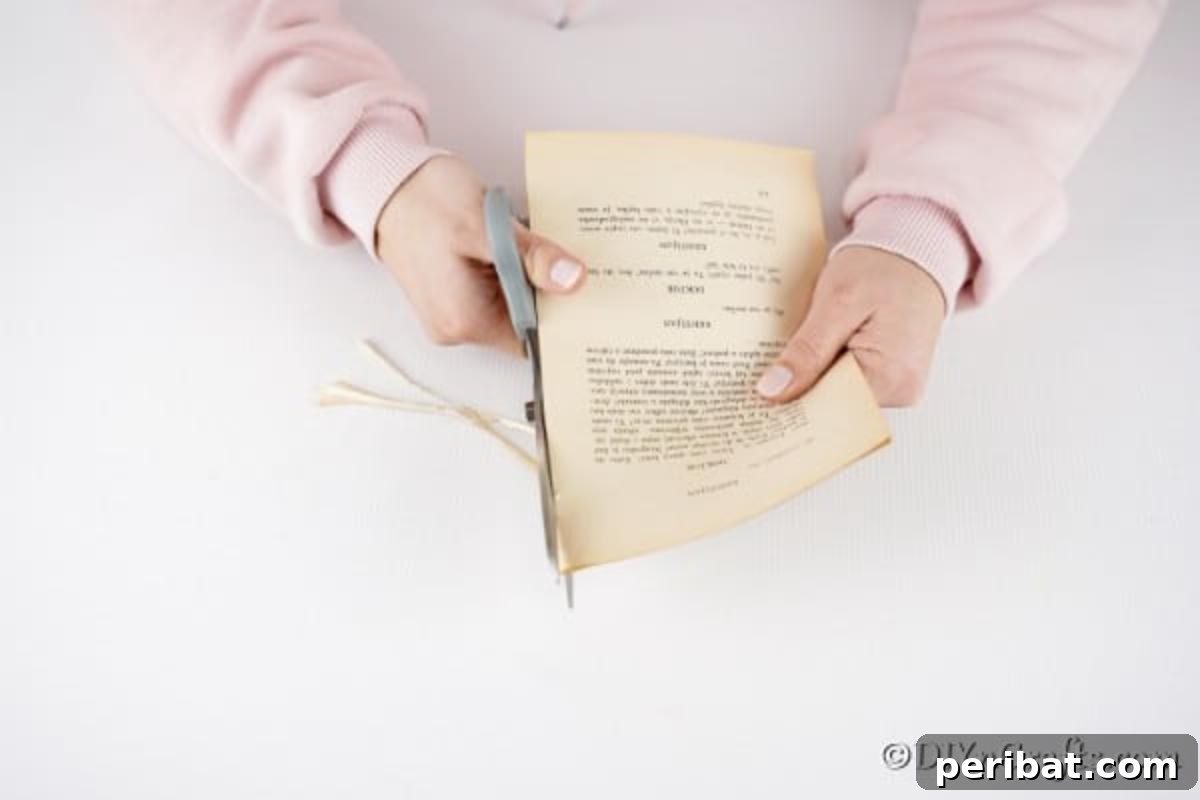 DIY Upcycled Book Page Easter Egg Garland Tutorial 10 Trim book binding off side of book pages