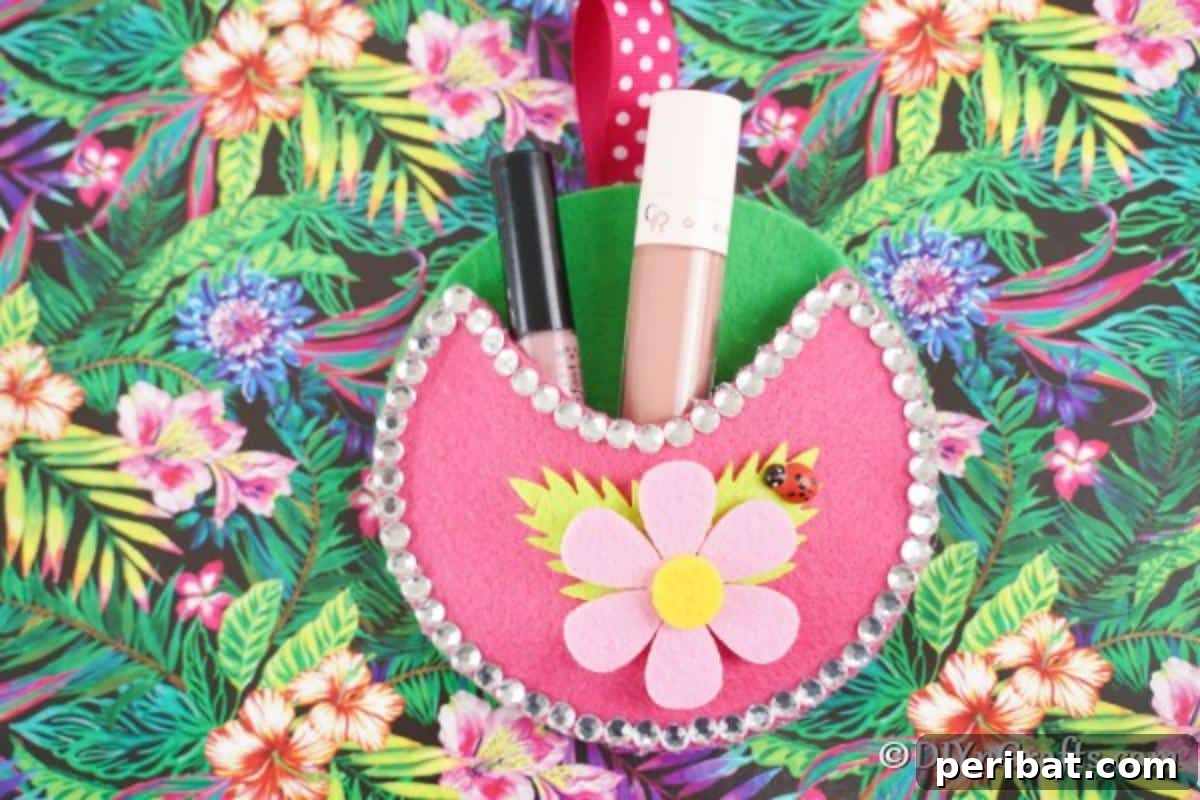 Repurposed CD DVD Wall Storage Pockets 5 Pink wall organizer on colorful surface