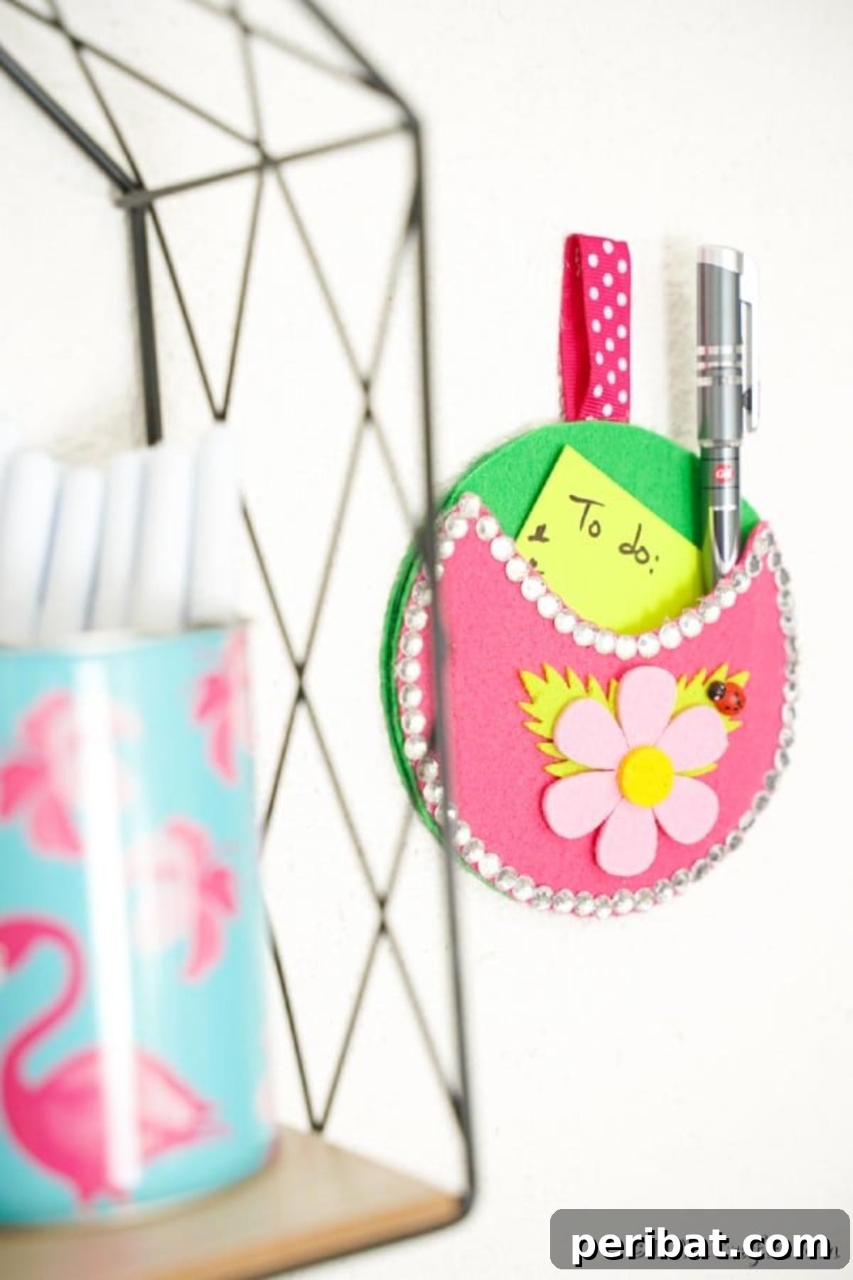 Repurposed CD DVD Wall Storage Pockets 6 Pocket wall organizer on wall by wire shelf