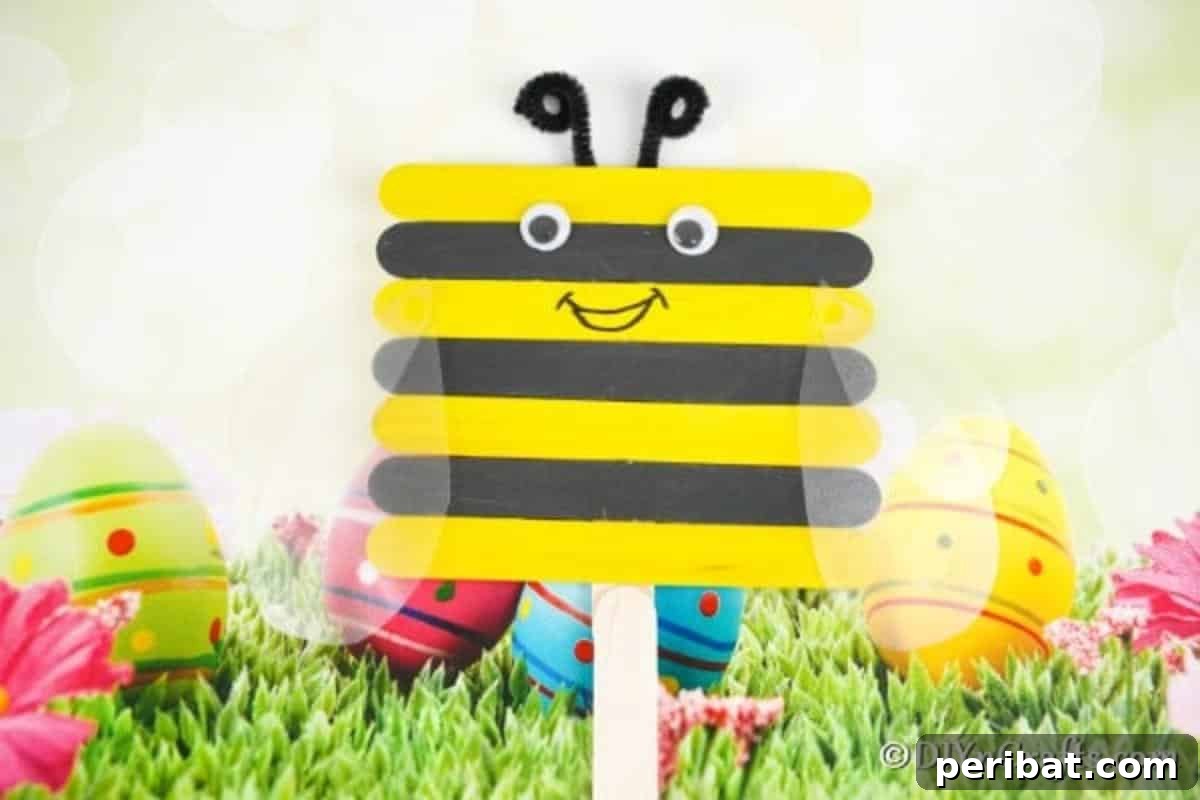 A finished craft stick bee displayed in front of a festive Easter background, ready for spring celebrations.