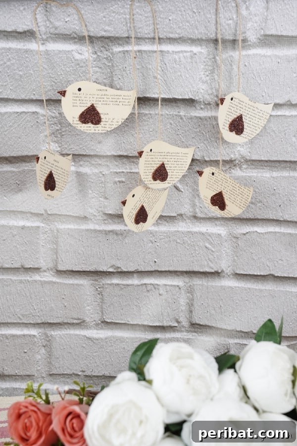 DIY Vintage Book Page Bird Wall Art 23 Old book page hanging birds wall art against brick wall