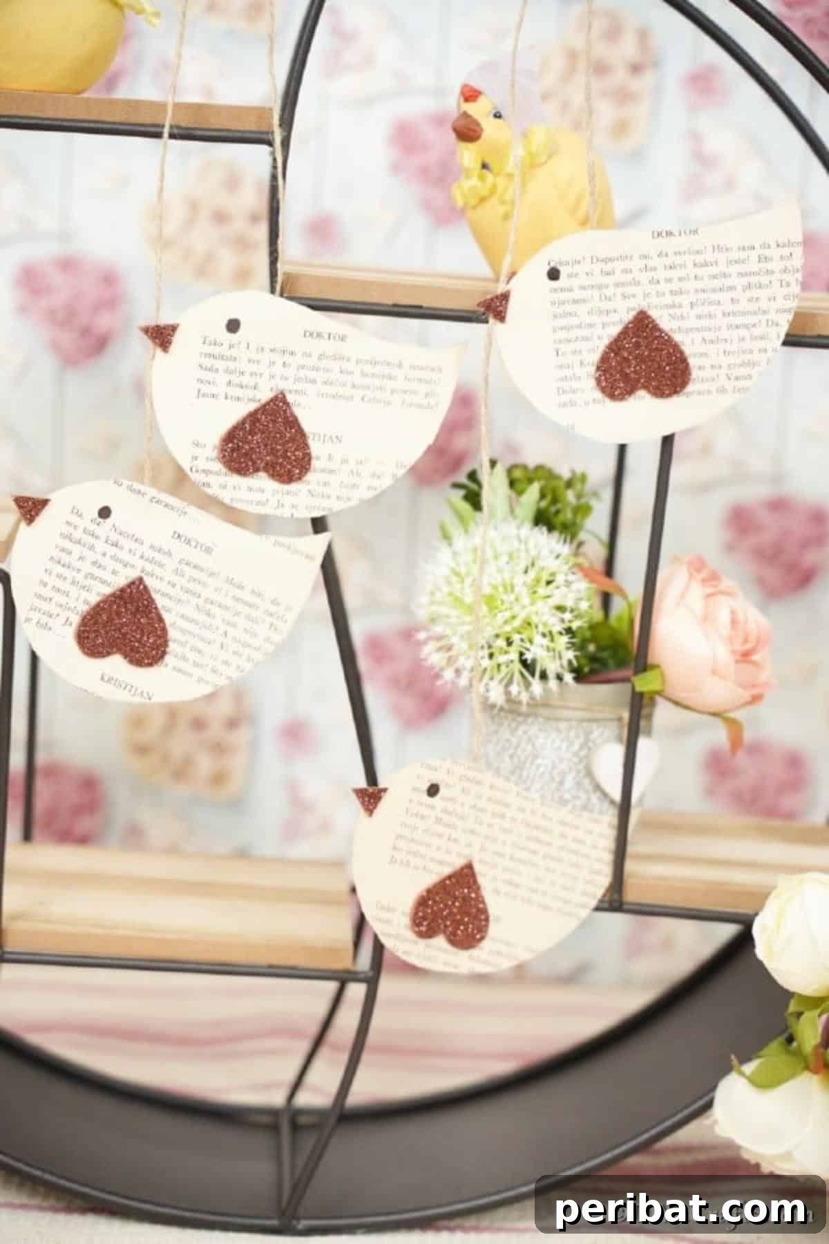 DIY Vintage Book Page Bird Wall Art 7 Elegant old book page birds displayed on a wire and wood shelf, showcasing a sophisticated rustic home decor arrangement.