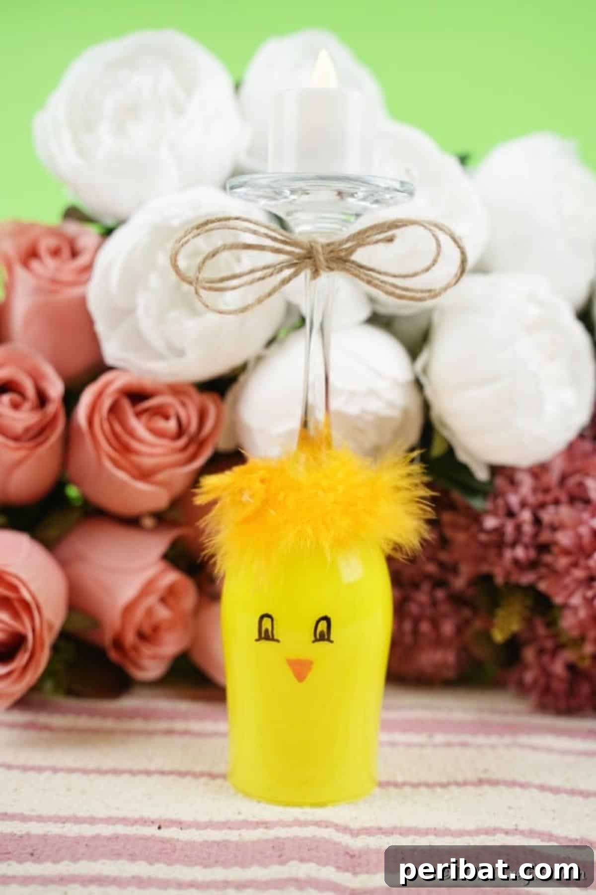 Adorable DIY Chick Wine Glass Luminary 3 Close-up of a painted wine glass chicken in front of delicate pink and white roses, highlighting the intricate details.