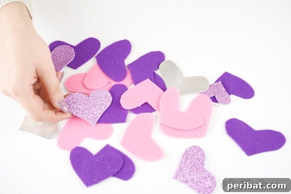 Whimsical Valentine Heart Mobile 17 Multiple paper hearts on white table