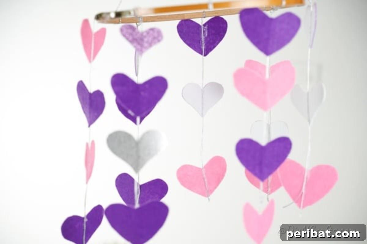 Whimsical Valentine Heart Mobile 4 Heart mobile hanging against white wall