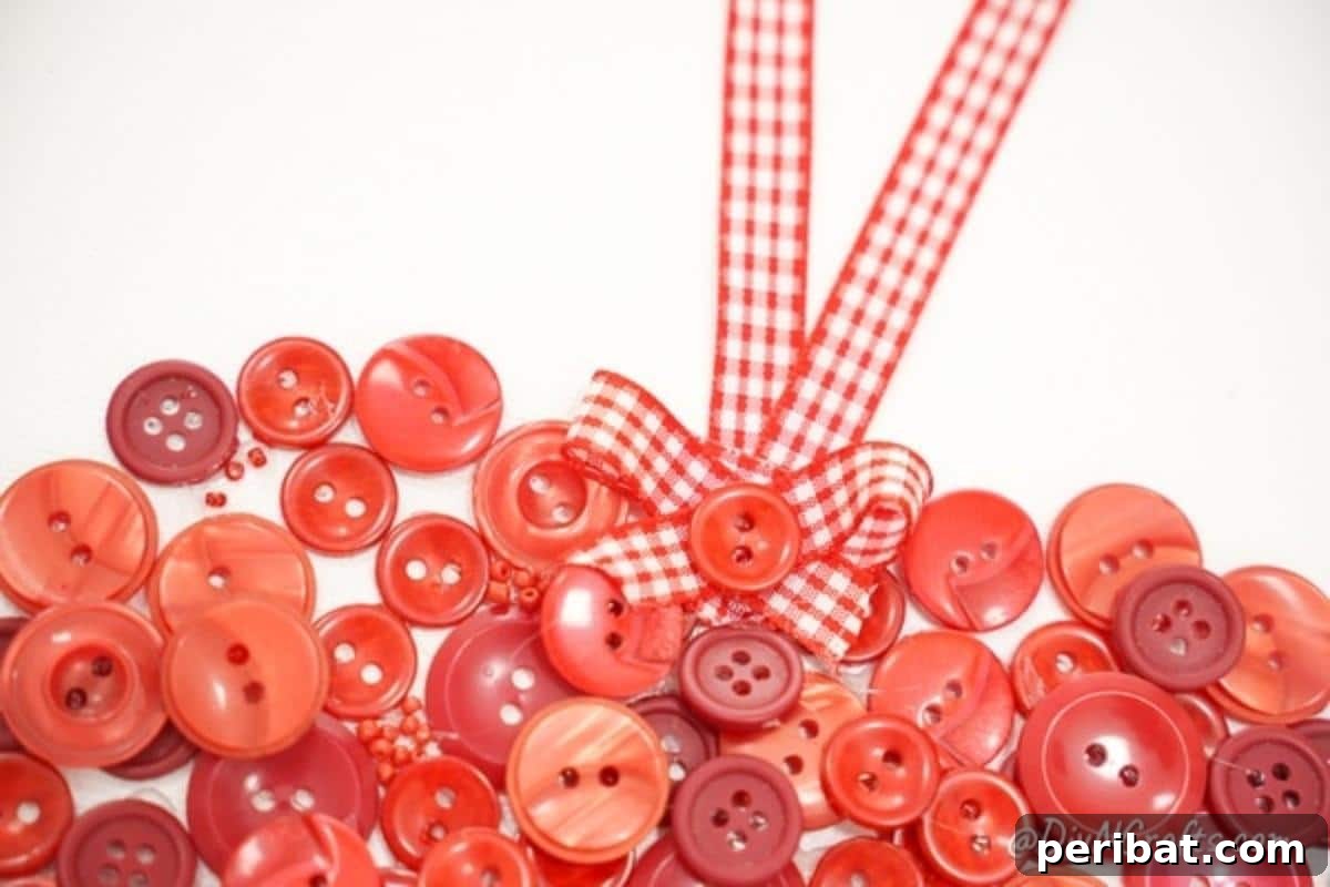 Charming Button Heart Canvas Decor 7 A close-up view of the top edge of a button heart Valentine's decoration, showcasing the intricate details and texture.