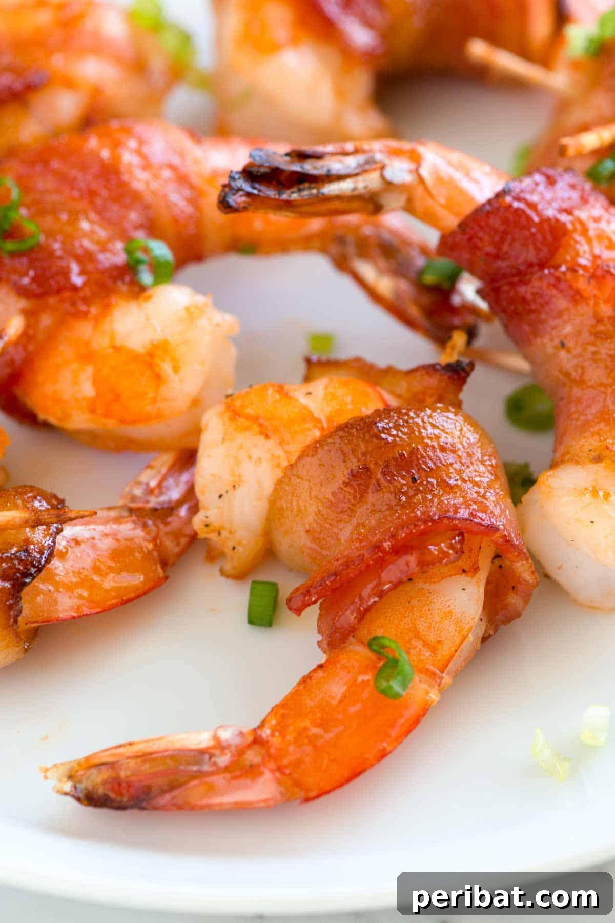 Bacon Beyond Belief: 26 Recipes for an Unforgettable Feast 18 Succulent shrimp wrapped in maple-glazed, spicy bacon, creating a harmonious blend of sweet, salty, and heat.