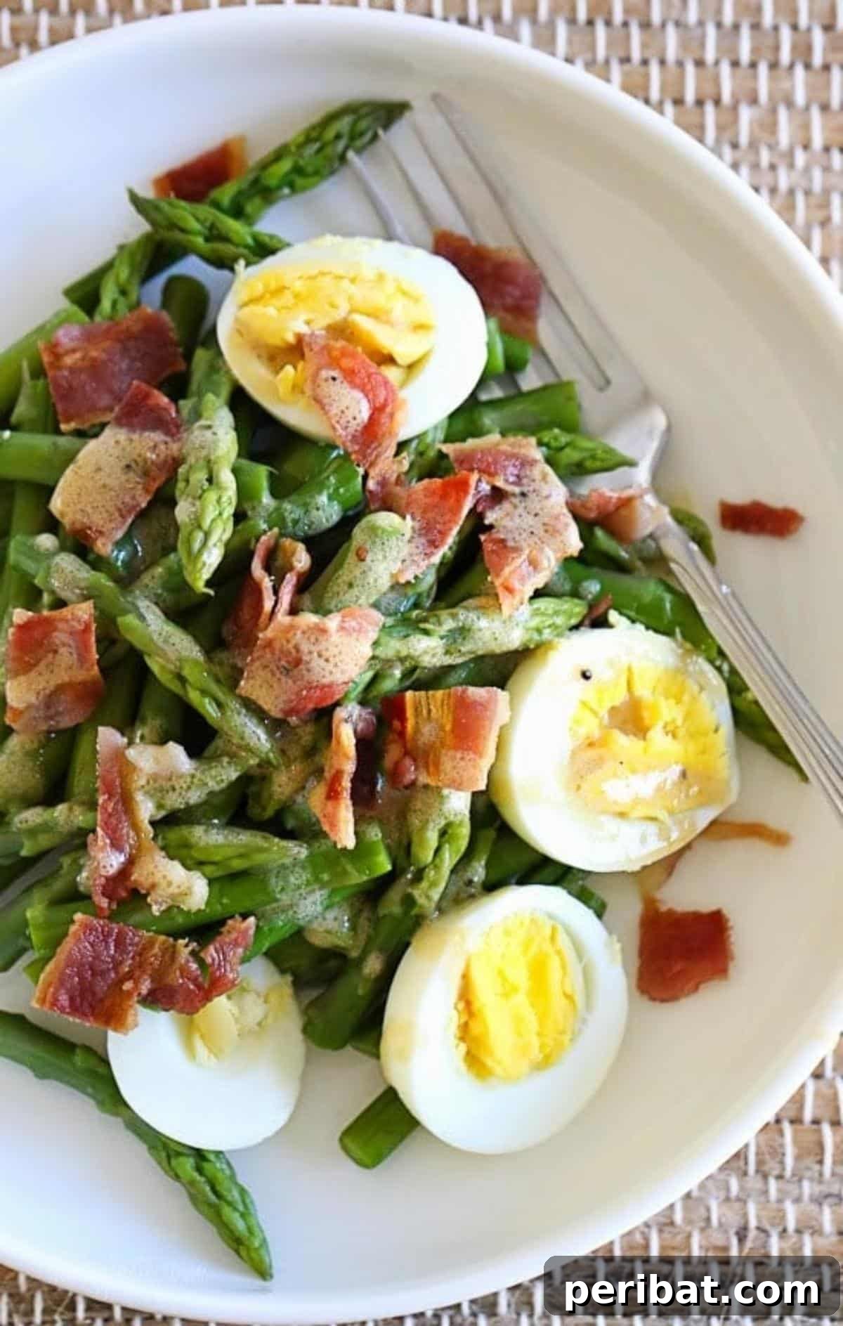 Bacon Beyond Belief: 26 Recipes for an Unforgettable Feast 20 A fresh and vibrant salad featuring crisp asparagus, hard-boiled eggs, and savory bacon bits, drizzled with Dijon vinaigrette.