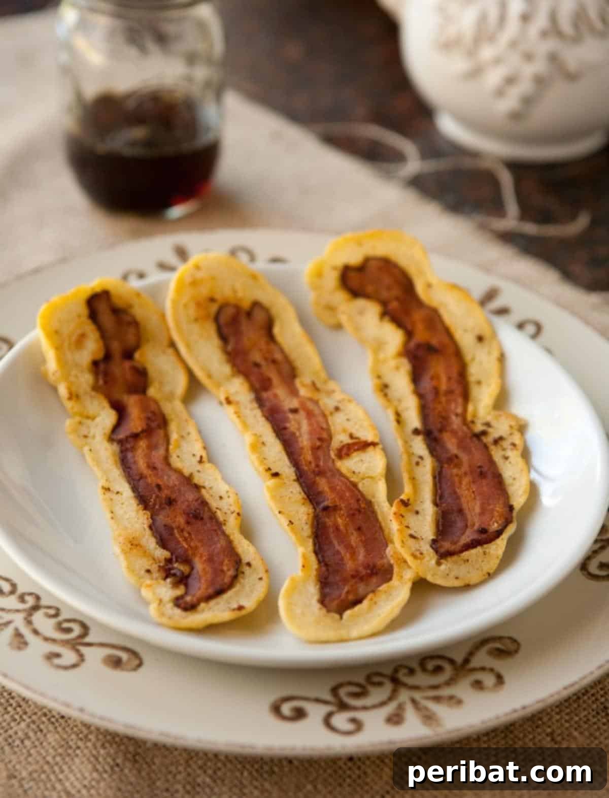 Bacon Beyond Belief: 26 Recipes for an Unforgettable Feast 3 Fluffy pancakes with crispy bacon strips cooked directly into the batter.