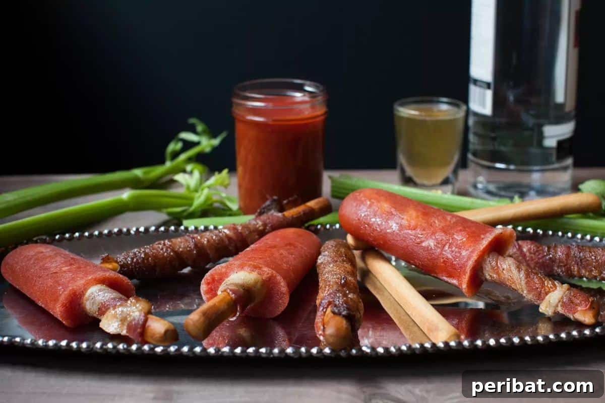 Bacon Beyond Belief: 26 Recipes for an Unforgettable Feast 22 Adult-friendly Bloody Mary popsicles, garnished with a unique bacon-wrapped breadstick for a boozy summer treat.