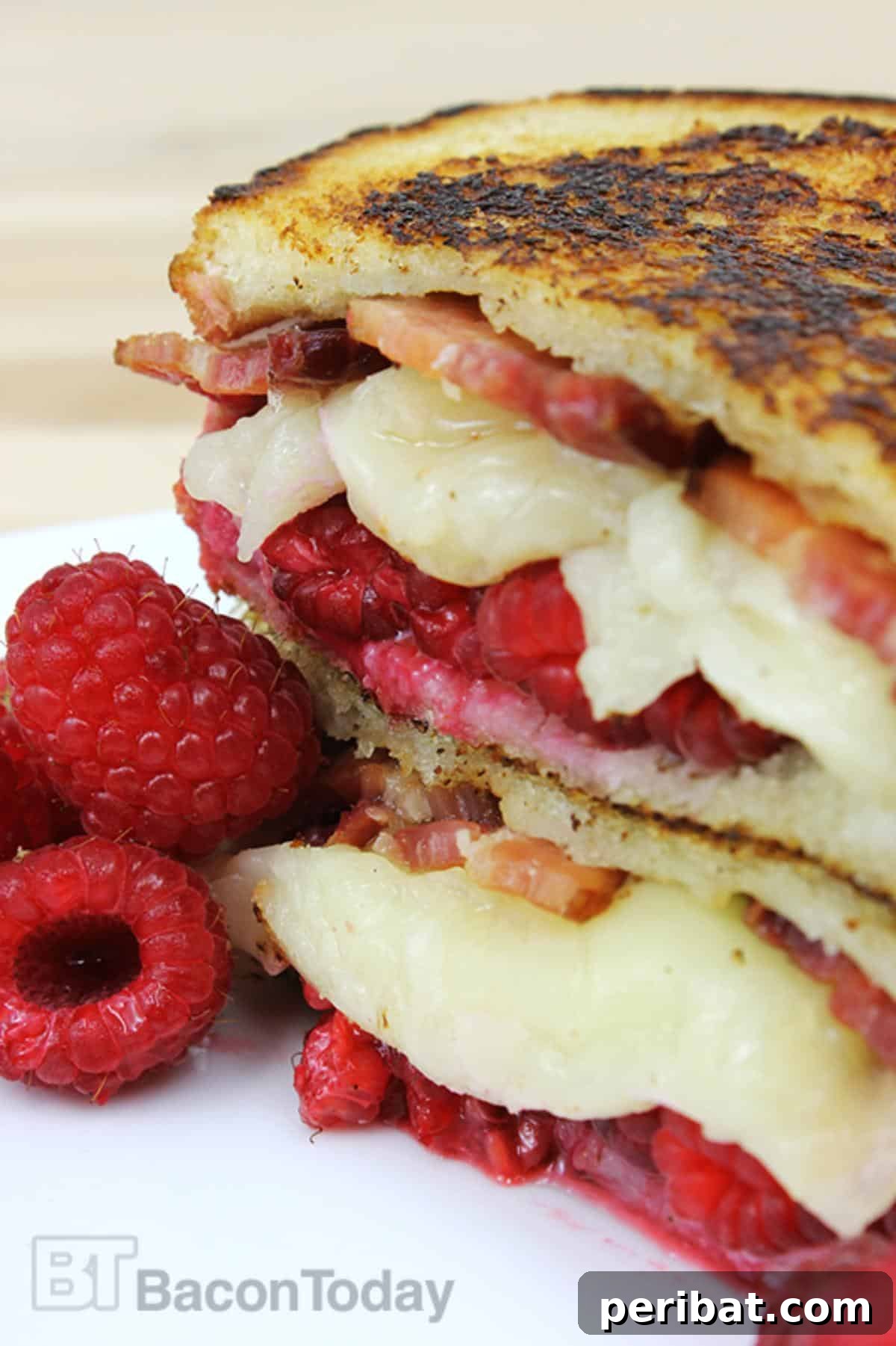 Bacon Beyond Belief: 26 Recipes for an Unforgettable Feast 25 A surprisingly delicious grilled cheese sandwich featuring sharp white cheddar, crispy bacon, and fresh raspberries.