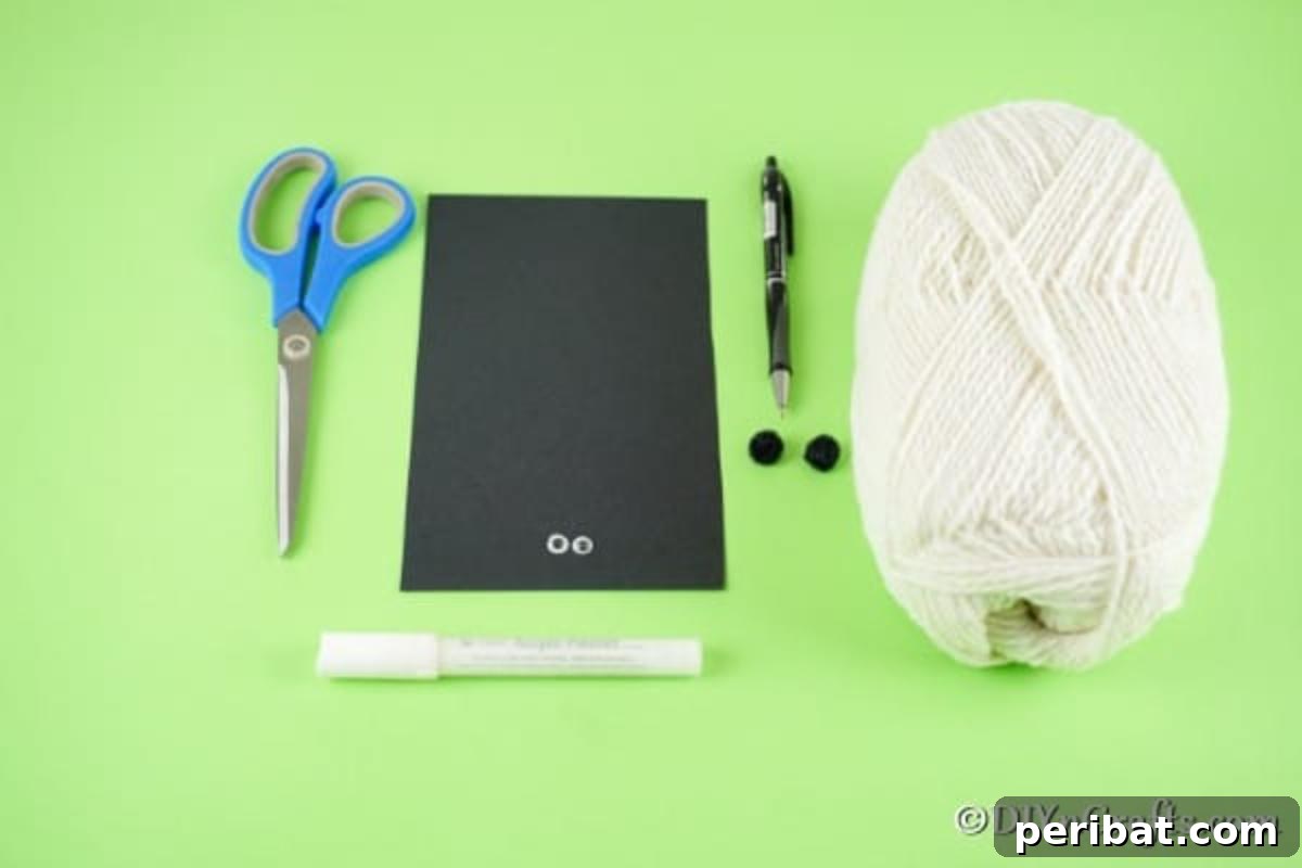 Fluffy Pom-Pom Sheep: A DIY Video Craft Guide 7 An organized flat lay of all the essential supplies for crafting a DIY pom pom sheep, including yarn, googly eyes, craft paper, glue, scissors, and mini black pom poms.
