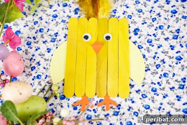 Popsicle stick chick on blue floral paper
