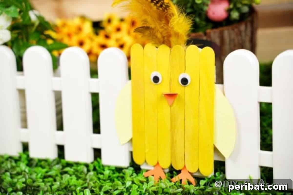 Colorful Craft Stick Chicken Painting 6 Charming popsicle stick chick standing proudly against a quaint mini white fence, perfect for Easter decor.