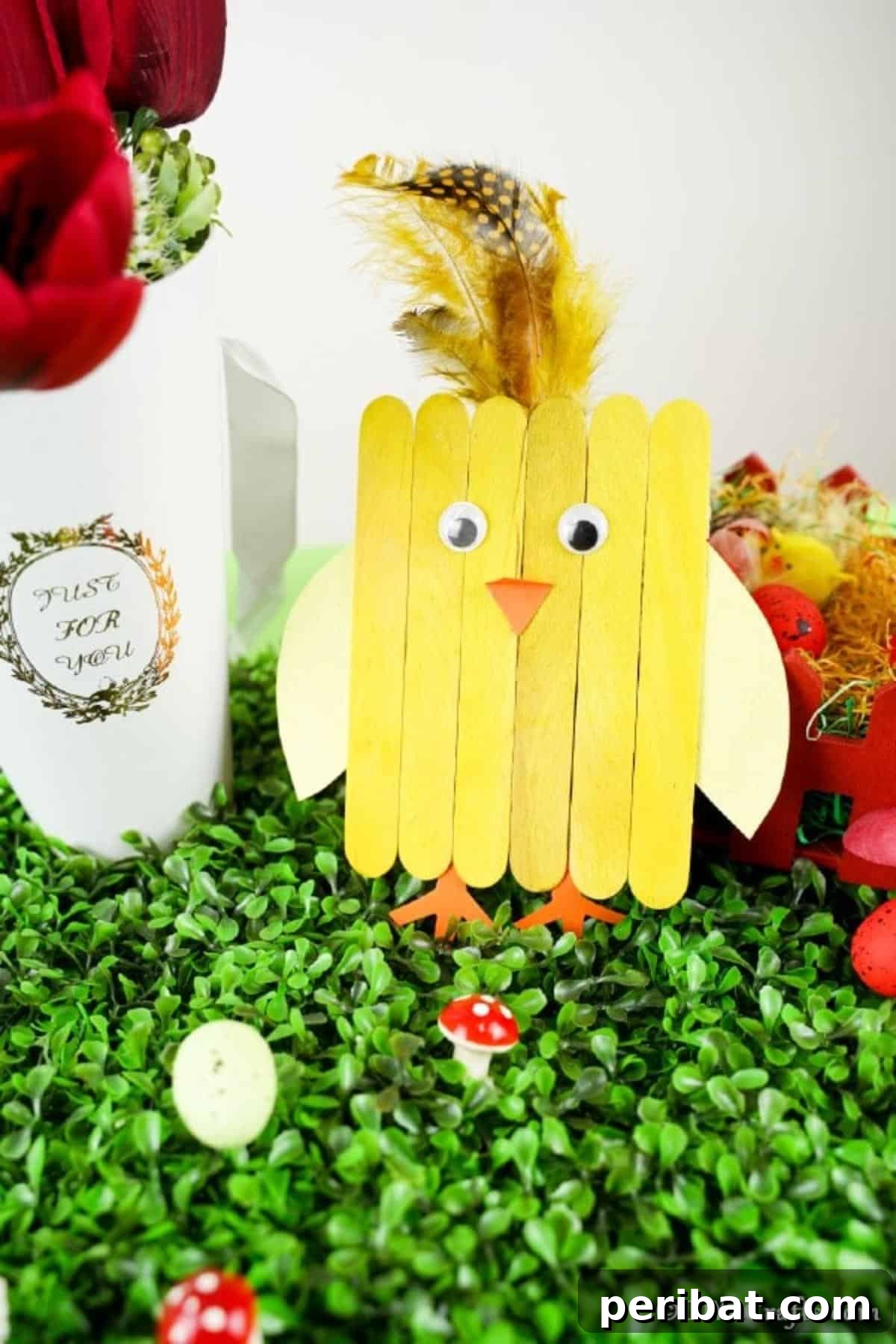 Colorful Craft Stick Chicken Painting 7 A cheerful yellow craft stick chicken standing proudly amidst other vibrant Easter decorations.