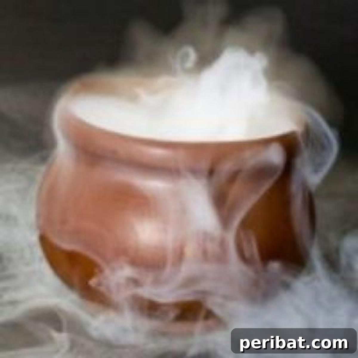 DIY Halloween: Craft Spine-Chilling Decor & Masterful Scares 4 A punch bowl emitting spooky fog from dry ice, perfect for a Halloween party.