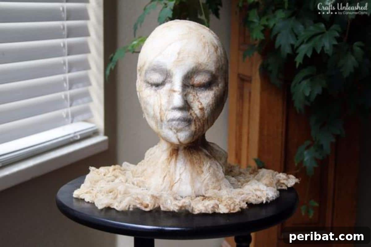 DIY Halloween: Craft Spine-Chilling Decor & Masterful Scares 9 A mummified, ghastly severed head decoration, perfect for a Halloween horror theme.