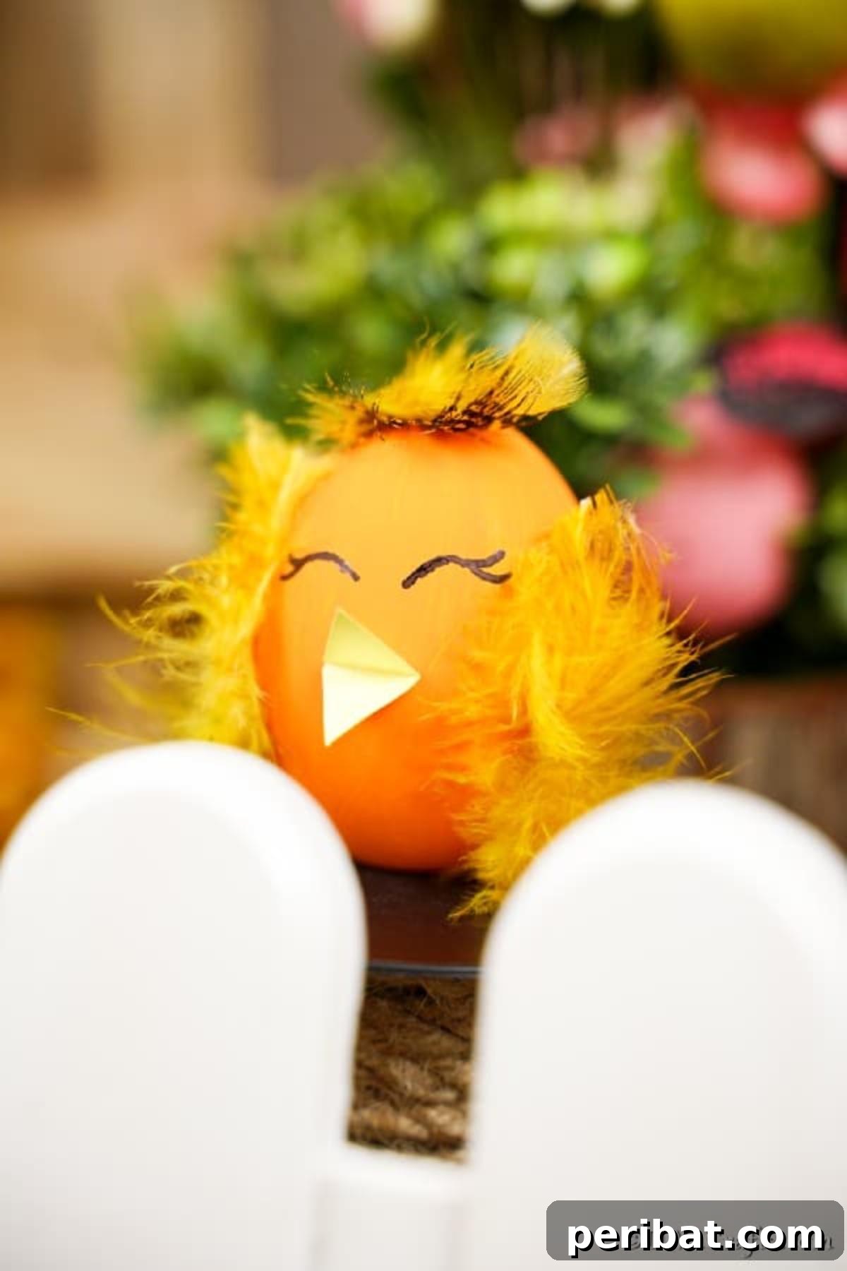 Craft Adorable Easter Egg Chickens A Step by Step Video Guide 4 A sweet Easter egg chicken craft peeking from behind a miniature white picket fence in a spring setting