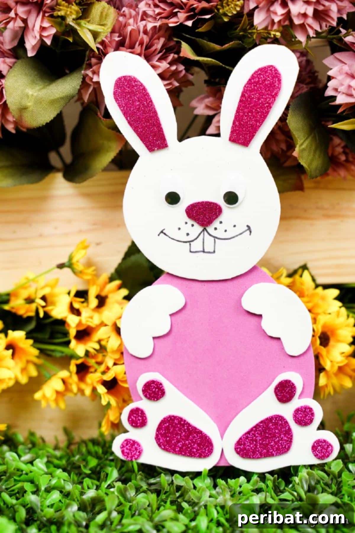Crafting Charming Foam Easter Bunnies 4 Foam pink bunny positioned among vibrant yellow flowers