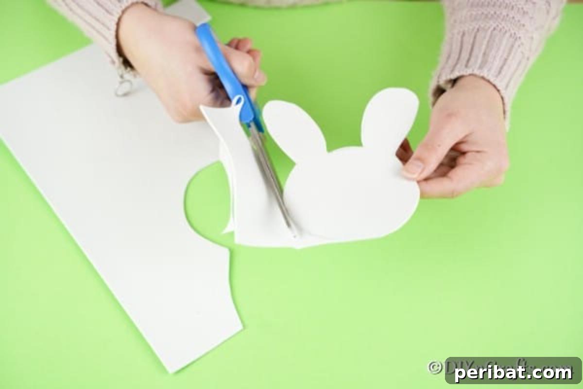 Crafting Charming Foam Easter Bunnies 8 Carefully cutting out the bunny head from white foam paper