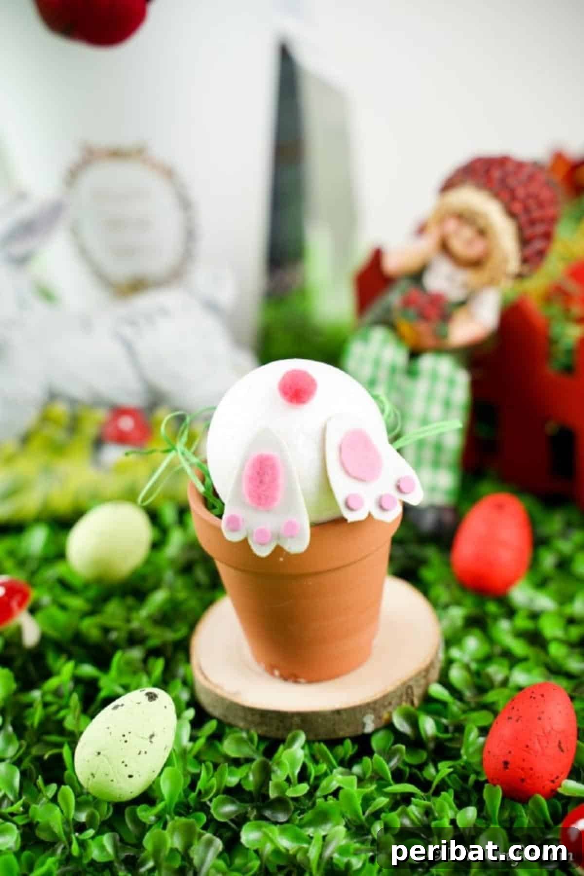 Easter Bunny Bloom Hideaway 13 Finished bunny butt flower pot craft displayed prominently amongst other festive Easter decorations
