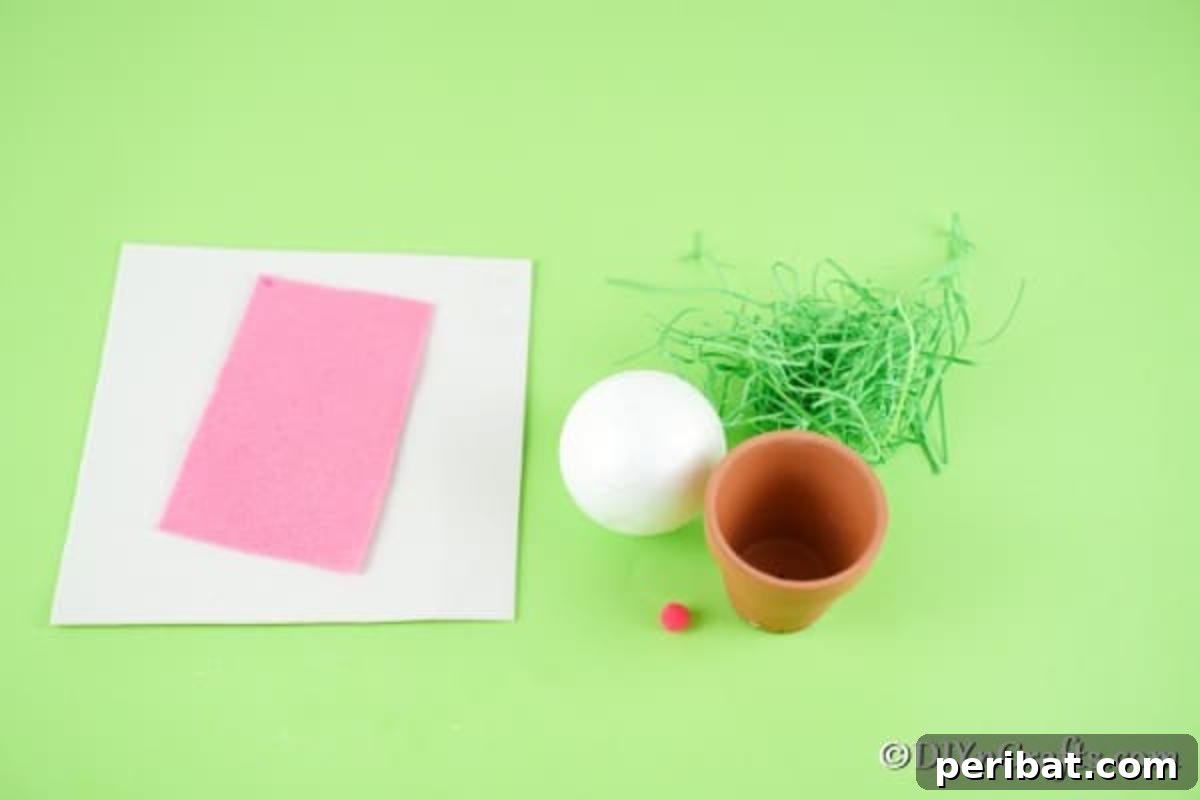 Easter Bunny Bloom Hideaway 6 Collection of colorful craft supplies neatly laid out for making the hiding bunny flower pot