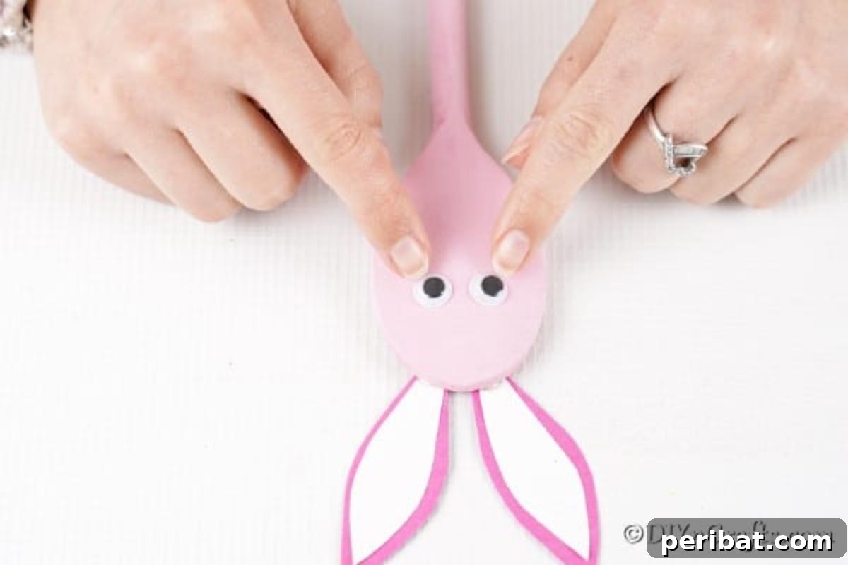 Adding googly eyes to spoon