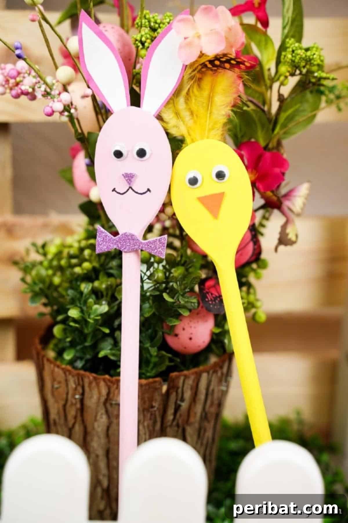Bunny and chick spoons against wooden stump