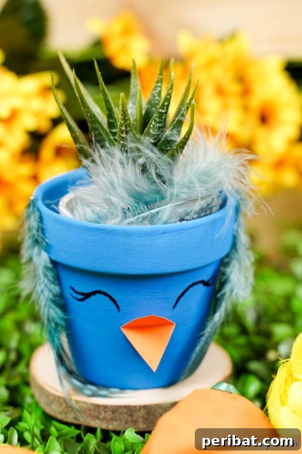 Whimsical Hand-Painted Bird Planter Charm 13 A finished blue bird flower pot on a wooden slice with bright yellow flowers