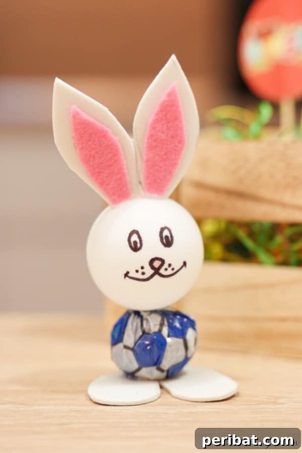 Crafting Adorable Easter Lollipop Bunnies 4 Lollipop bunny with pink ears on table