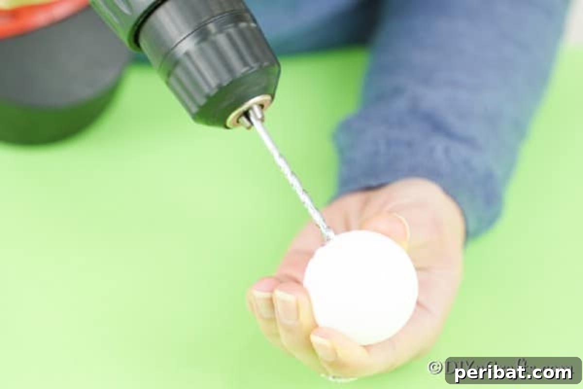Crafting Adorable Easter Lollipop Bunnies 7 Drilling a hole through a ping pong ball