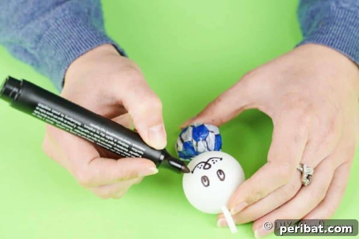 Crafting Adorable Easter Lollipop Bunnies 9 Drawing a face on the ping pong ball
